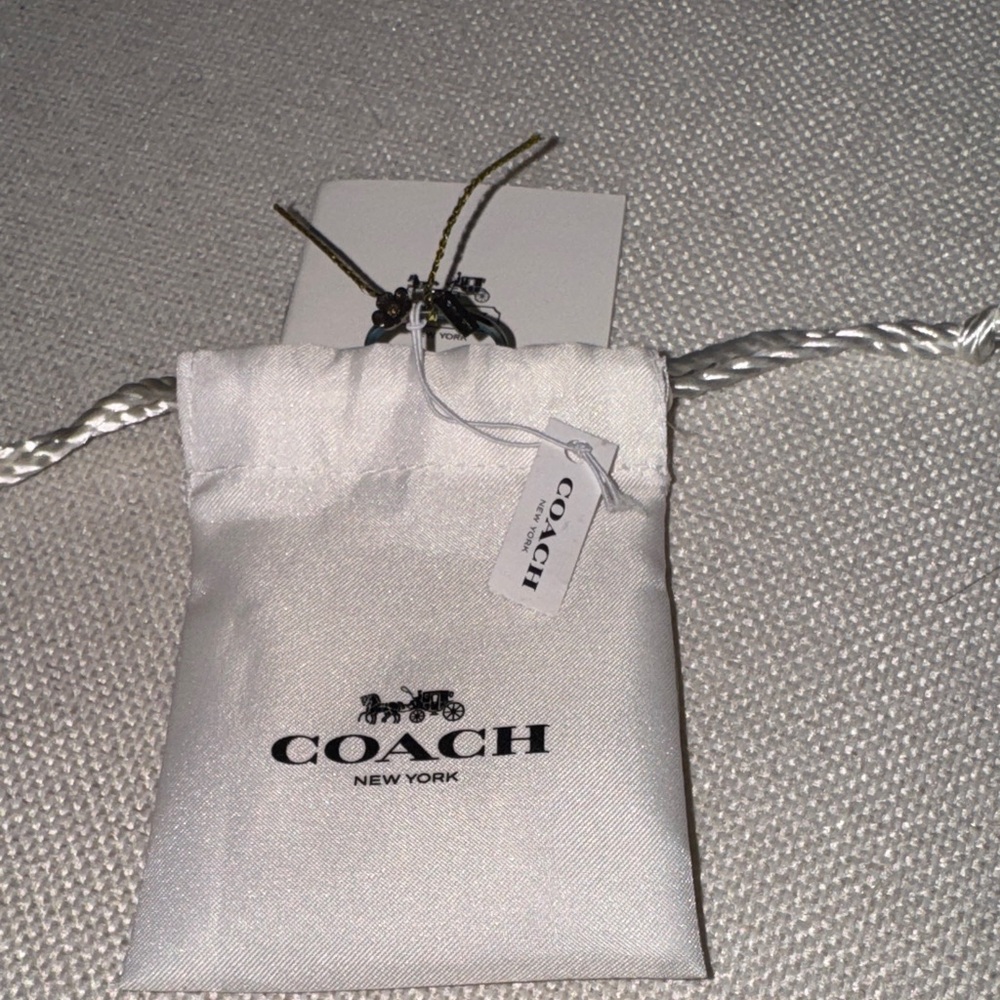 NWT, Coach vintage pinky tea rose ring . Navy blue tint.